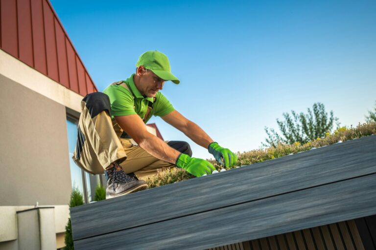 Professional Caucasian Gardener Building Living Roof on a Garden Shed