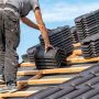 ceramic tiles on the roof, installation of a new roof by an expert